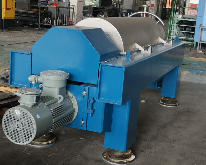 Twophase scroll discharge decanter centrifuge for centrifugal dewatering